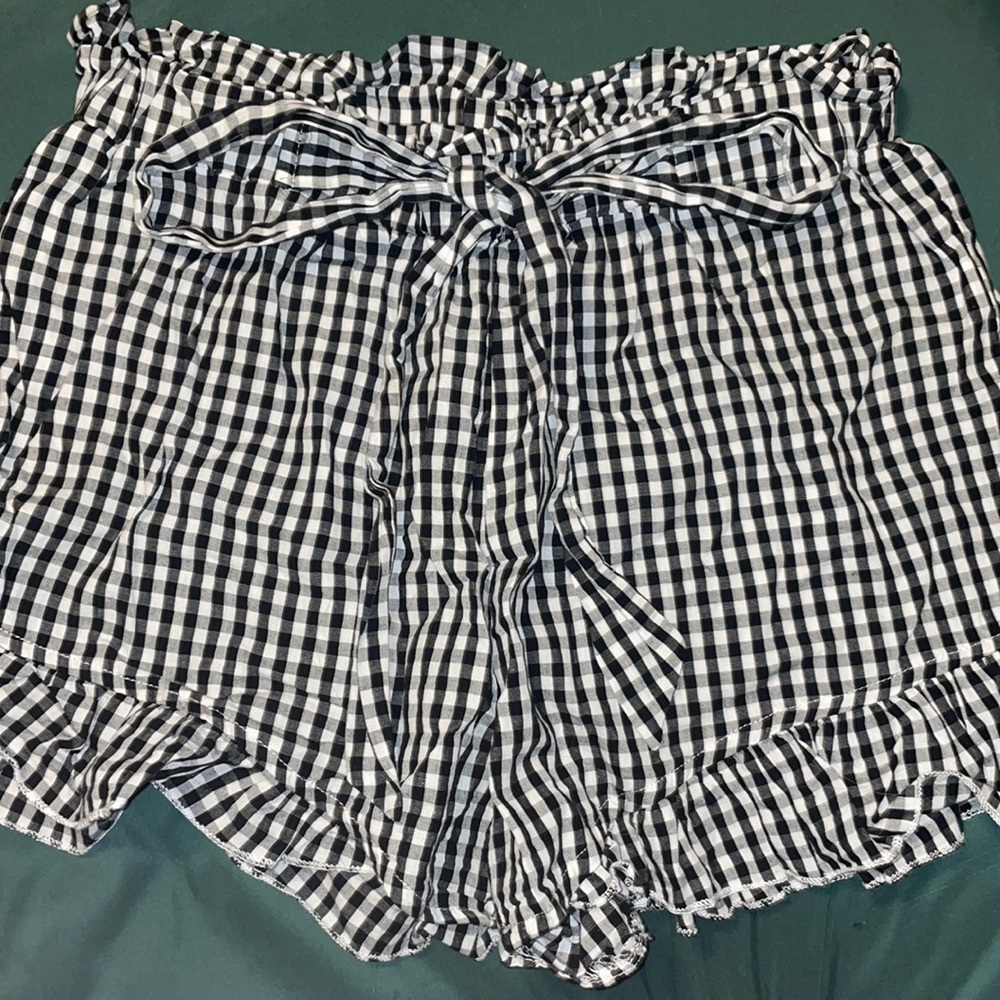 checker print shorts with ruffled ends and elastic waste band.